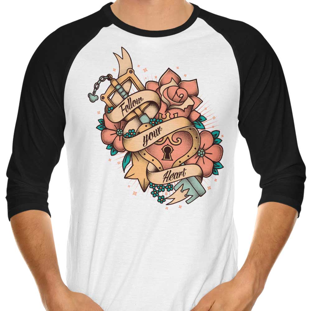 Stylish 3/4 Sleeve Raglan T-Shirt with 'Follow Your Heart' Design by Typhoonic Art