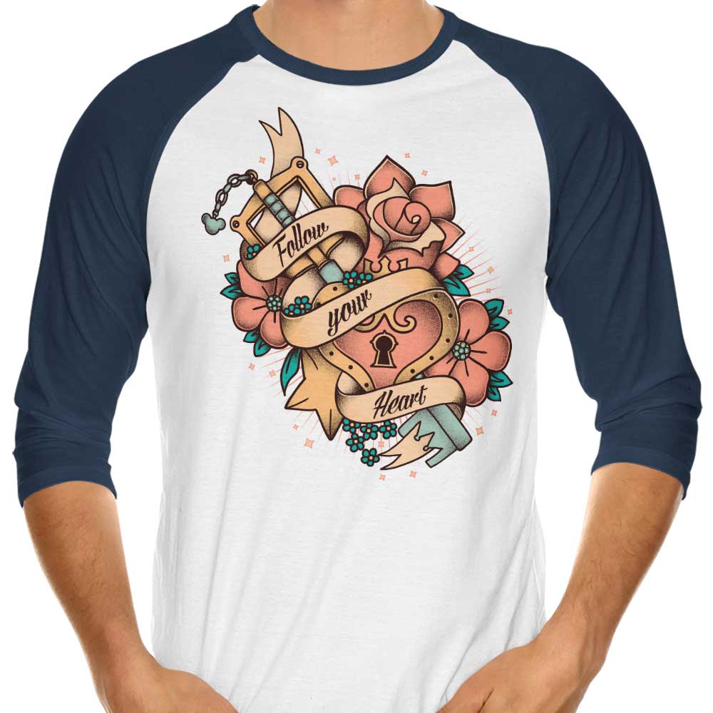Stylish 3/4 Sleeve Raglan T-Shirt with 'Follow Your Heart' Design by Typhoonic Art