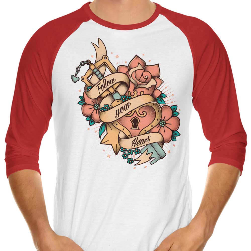 Stylish 3/4 Sleeve Raglan T-Shirt with 'Follow Your Heart' Design by Typhoonic Art